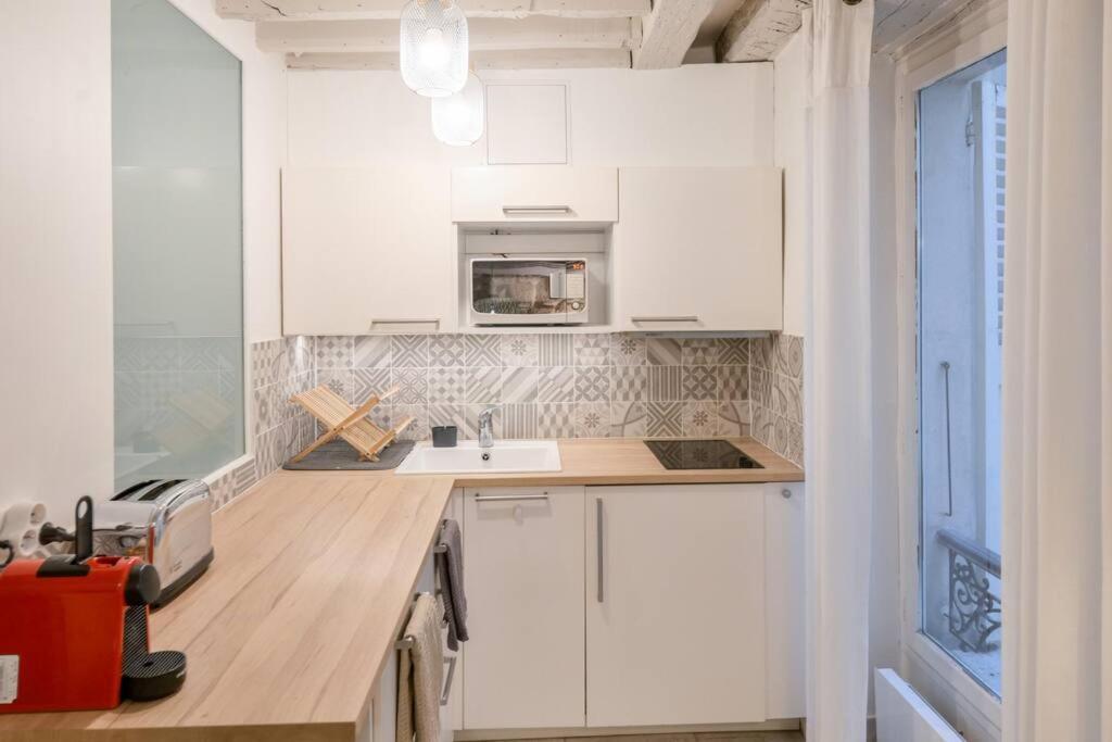 Cosy Appartement En Plein Marais باريس المظهر الخارجي الصورة